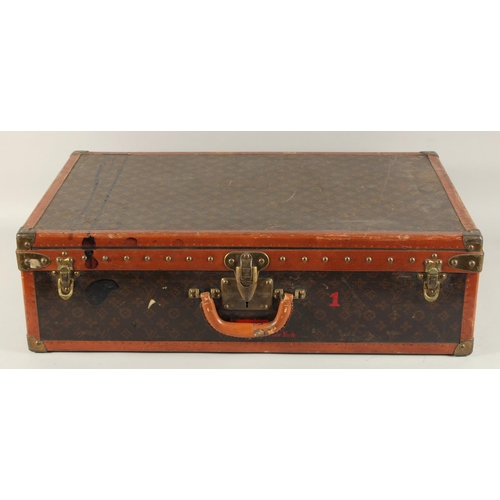 1514 - A LOUIS VUITTON SUITCASE. No. 81494, with Louis Vuitton label. Related label, bought from SAKS & Co.... 