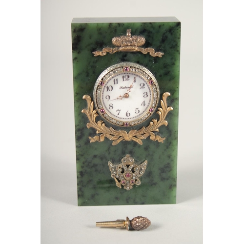 1521 - A GOOD RUSSIAN JADE, SILVER, AND DIAMOND SET CLOCK. 4.5ins high x 2.25ins wide. Marks, H. W., Faberg... 