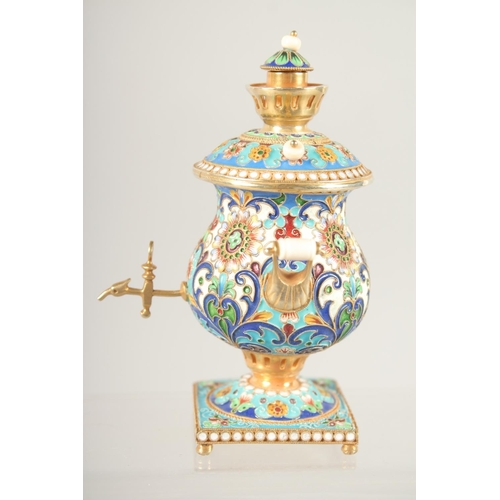 1522 - A MINIATURE RUSSIAN SILVER GILT AND CLOISONNE ENAMEL SAMOVAR. 3.75ins high, Mark 84