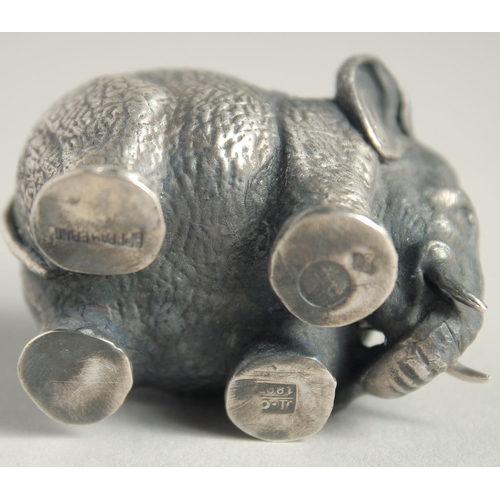 1528 - A SMALL RUSSIAN SILVER ELEPHANT SALT, 1.75ins long. Mark, No. over 1897, Eagle, Faberge mark.