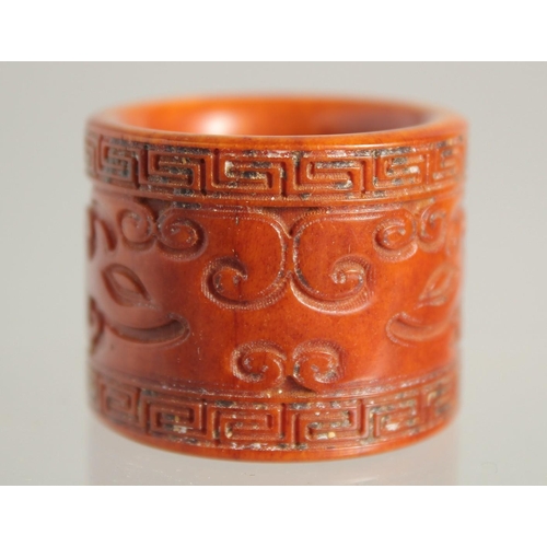 1534 - A CARVED BONE ARCHER'S RING. 1.25ins.