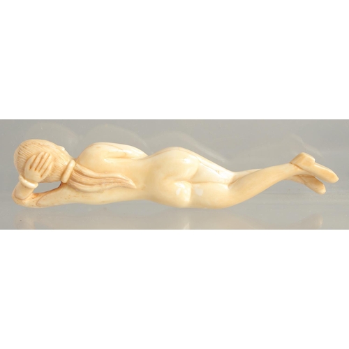 1535 - A CARVED BONE NUDE FIGURE 5ins long.