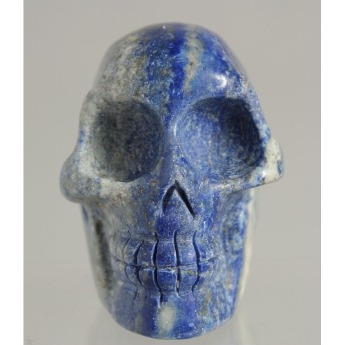 1538 - A CARVED LAPIS SKULL 2ins high.