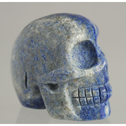 1538 - A CARVED LAPIS SKULL 2ins high.