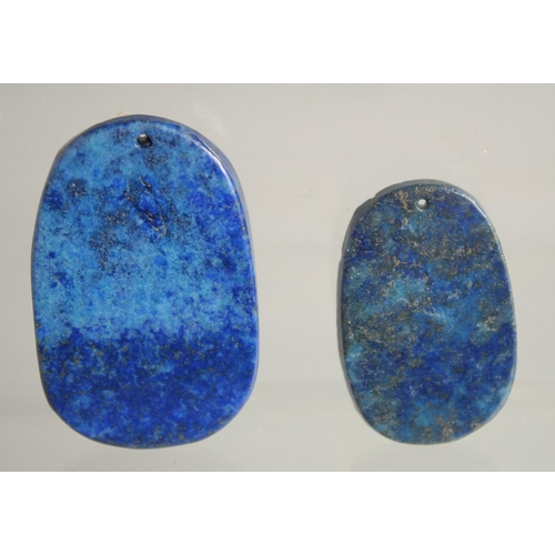 1540 - TWO CARVED LAPIS PENDANTS.