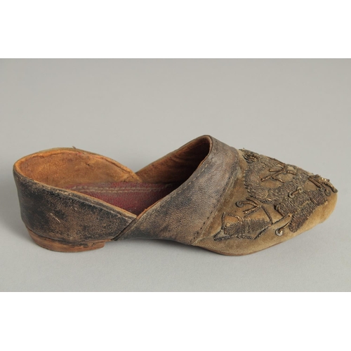 1545 - A SMALL PAIR OF 17TH CENTURY LEATHER SHOES.