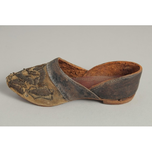 1545 - A SMALL PAIR OF 17TH CENTURY LEATHER SHOES.