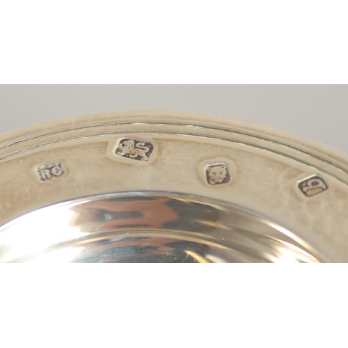 1558 - A SMALL PAIR OF SILVER CIRCULAR ARMADA DISHES, 3ins diameter. London 1970 and a small dish with inse... 