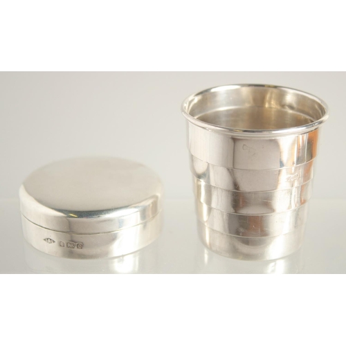 1562 - A SMALL SILVER COLLAPSIBLE BEAKER AND BOX. Birmingham 1902 - Cup diameter 4.5cm - Extended height 4c... 