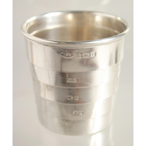 1562 - A SMALL SILVER COLLAPSIBLE BEAKER AND BOX. Birmingham 1902 - Cup diameter 4.5cm - Extended height 4c... 