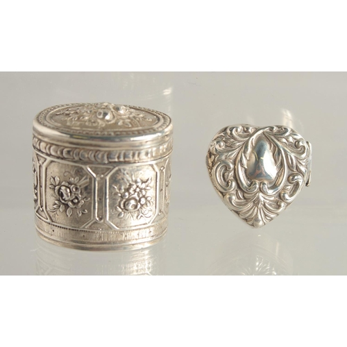 1564 - A SMALL FRENCH OVAL SILVER BOX AND COVER 1.25ins and a heart shaped box. (2).