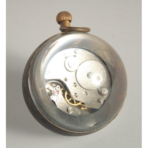 1571 - A GLASS BALL CLOCK. 2ins diameter.