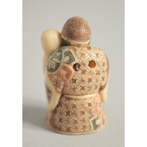 1576 - A BONE NETSUKE OF A MAN. Signed, 1.75ins.