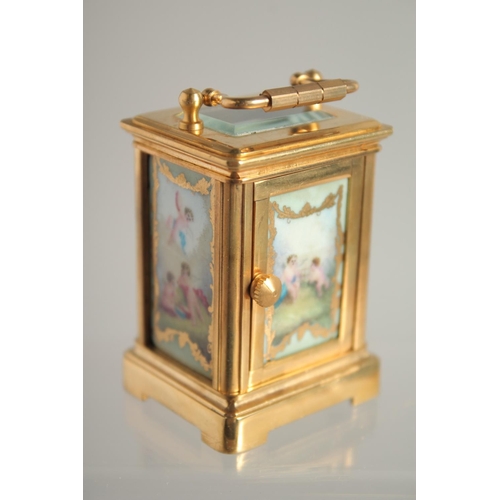 1605 - A MINIATURE BRASS CARRIAGE CLOCK 2ins high.