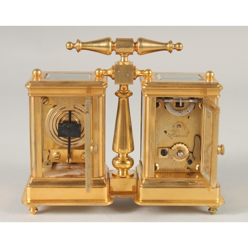 1637 - A GILT BRONZE DOUBLE CARRIAGE CLOCK. 4ins high with carrying handle.