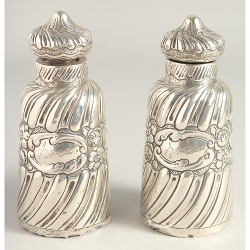 1660 - TWO VICTORIAN SILVER SCENT BOTTLES AND STOPPERS. 5ins high.