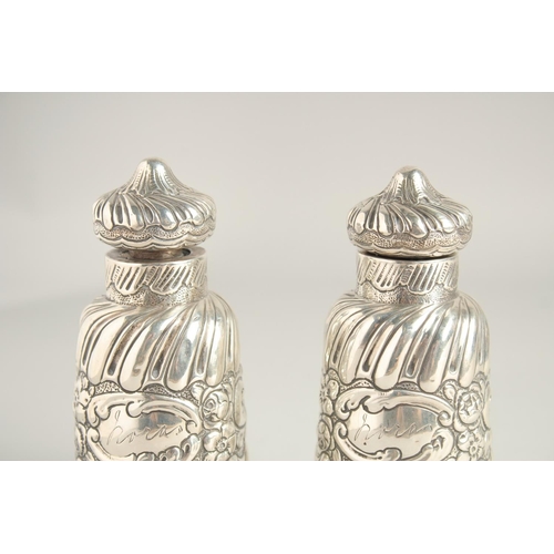 1660 - TWO VICTORIAN SILVER SCENT BOTTLES AND STOPPERS. 5ins high.