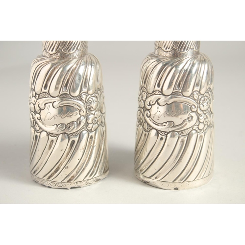 1660 - TWO VICTORIAN SILVER SCENT BOTTLES AND STOPPERS. 5ins high.