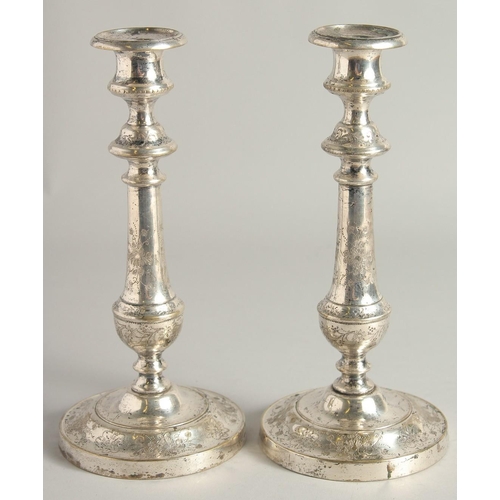 1662 - A PAIR OF FRENCH PLAIN CANDLESTICKS. 9.5ins high.