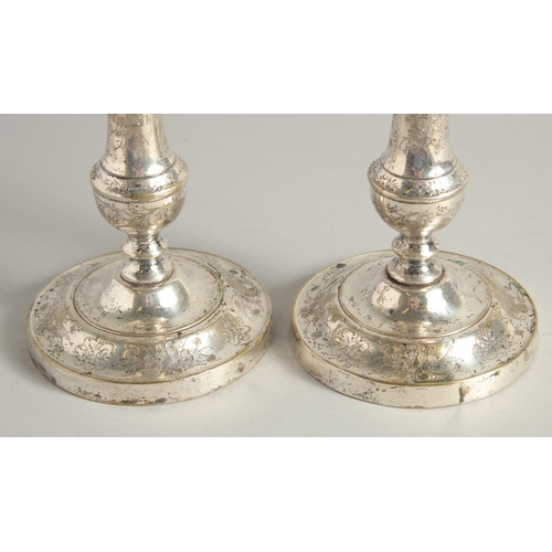 1662 - A PAIR OF FRENCH PLAIN CANDLESTICKS. 9.5ins high.