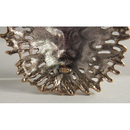 1674 - A CHANEL GILT COSTUME LION HEAD BROOCH with white label and Chanel box.