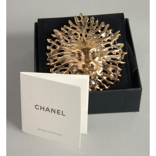 1674 - A CHANEL GILT COSTUME LION HEAD BROOCH with white label and Chanel box.