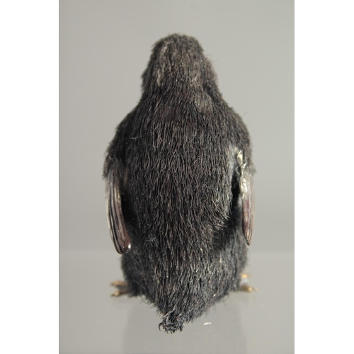 1676 - A MARIO BUCCULLATI SILVER THREAD PENGUIN. Signed. 3ins high in a blue box.