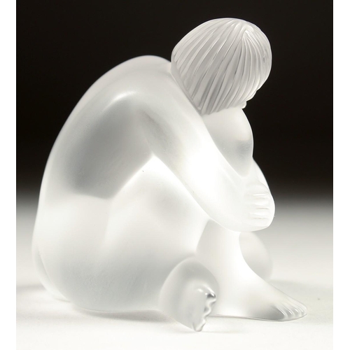 1684 - A LALIQUE FROSTED GLASS FIGURE sitting crossed leg. Signed. 3ins in a Lalique box.