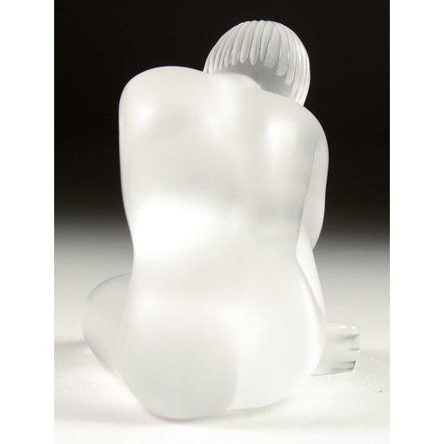 1684 - A LALIQUE FROSTED GLASS FIGURE sitting crossed leg. Signed. 3ins in a Lalique box.