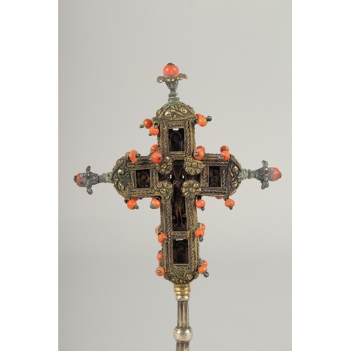 1697 - A SMALL 17TH -18TH CENTURY SILVER GILT CROSS enclosing a coral crucifix, with inscriptions and dated... 