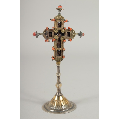 1697 - A SMALL 17TH -18TH CENTURY SILVER GILT CROSS enclosing a coral crucifix, with inscriptions and dated... 