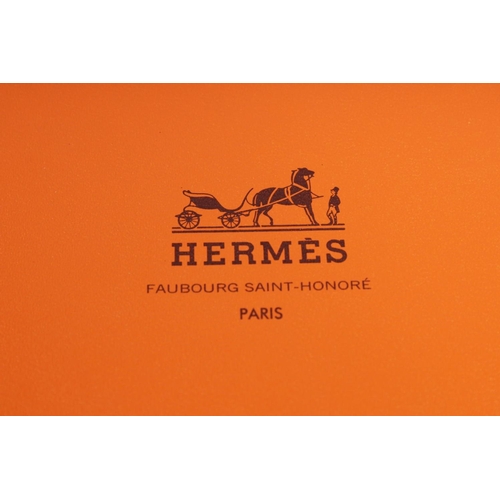 1698 - AN HERMES SILK SCARF, puppet and toy on a blue ground. 34ins x 334ins in a Hermes box.