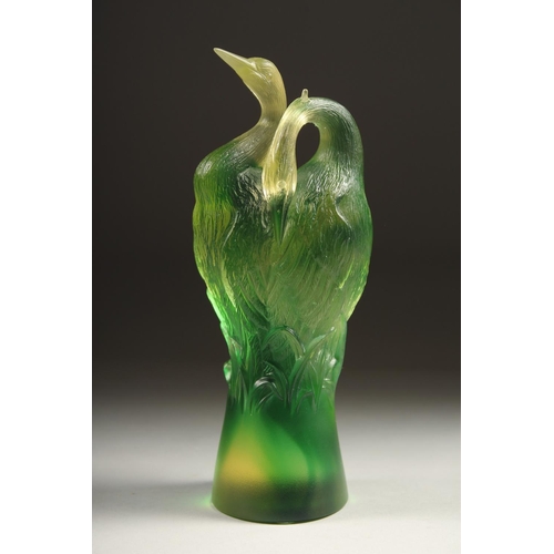 1713 - A GOOD PAIR OF TITTOT GREEN GLASS ENTWINED BIRDS. Signed 6.5ins high.