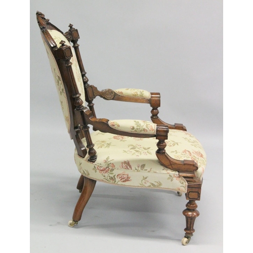 1001 - A GOOD VICTORIAN CARVED WALNUT NURSING AND MATCHING ARMCHAIR with padded back, arms and seat, suppor... 