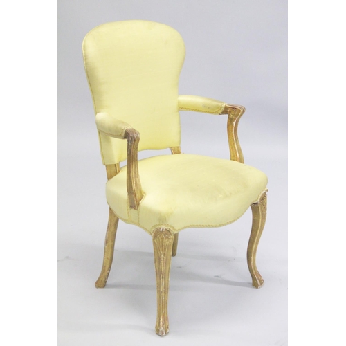 1004 - A PAIR OF FRENCH HEPPLEWHITE GILDED ARMCHAIRS with yellow padded backs and seats.