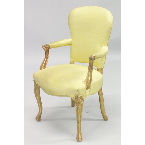 1004 - A PAIR OF FRENCH HEPPLEWHITE GILDED ARMCHAIRS with yellow padded backs and seats.