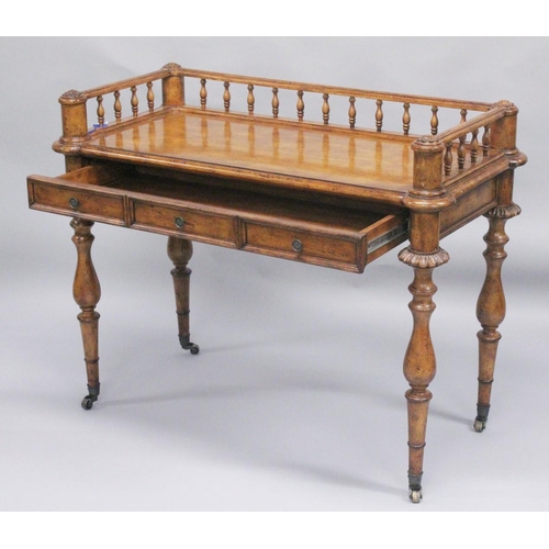 1009 - A 19TH CENTURY STYLE WALNUT WRITING TABLE with spindle back, sliding drawer with fall front, on turn... 