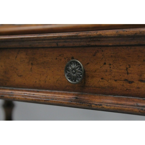 1009 - A 19TH CENTURY STYLE WALNUT WRITING TABLE with spindle back, sliding drawer with fall front, on turn... 