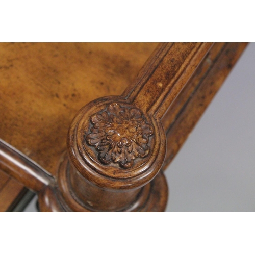 1009 - A 19TH CENTURY STYLE WALNUT WRITING TABLE with spindle back, sliding drawer with fall front, on turn... 