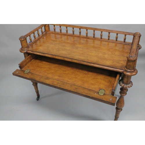 1009 - A 19TH CENTURY STYLE WALNUT WRITING TABLE with spindle back, sliding drawer with fall front, on turn... 