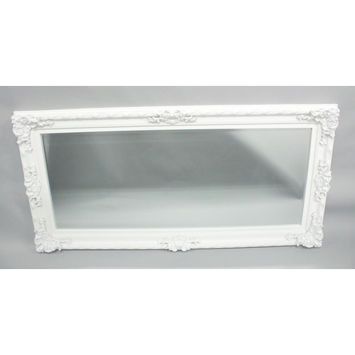 1021 - A LARGE WHITE PAINTED MIRROR. 5ft 6ins x 2ft 8ins.