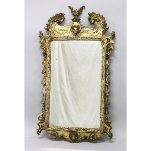 1041 - A GOOD GEORGE III DESIGN CARVED WOOD AND GILDED MIRROR with acanthus scrolls, masks and urns. 3ft 11... 