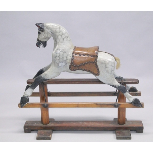 1043 - A VICTORIAN PAINTED WOOD ROCKING HORSE. 2ft 8ins high.