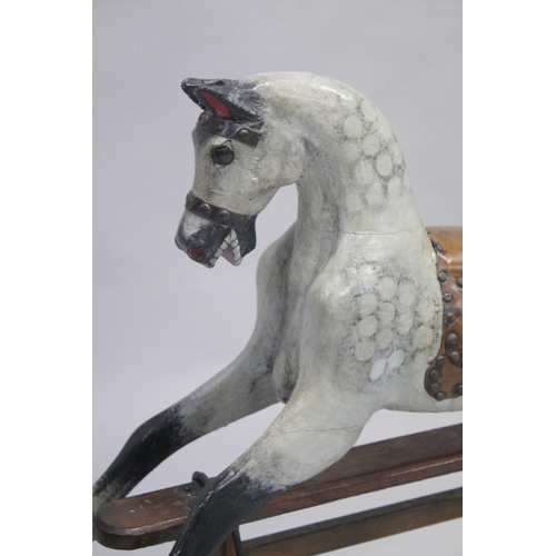 1043 - A VICTORIAN PAINTED WOOD ROCKING HORSE. 2ft 8ins high.