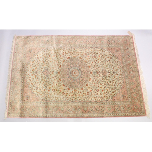 1056 - A GOOD SHIRVAN SILK RUG, pink ground with all over floral decoration. 6ft 5ins x 4ft 3ins.