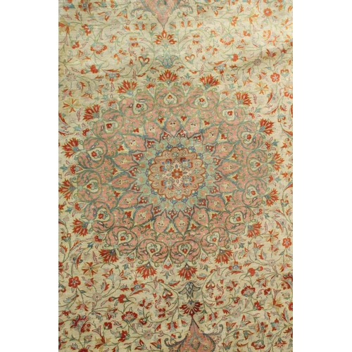 1056 - A GOOD SHIRVAN SILK RUG, pink ground with all over floral decoration. 6ft 5ins x 4ft 3ins.