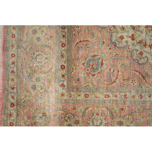 1056 - A GOOD SHIRVAN SILK RUG, pink ground with all over floral decoration. 6ft 5ins x 4ft 3ins.