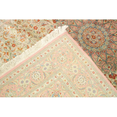 1056 - A GOOD SHIRVAN SILK RUG, pink ground with all over floral decoration. 6ft 5ins x 4ft 3ins.