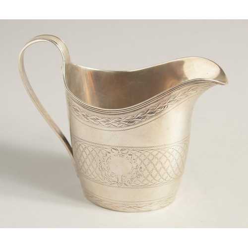 1881 - A GEORGE III SILVER CREAM JUG with reeded edge and engraved body. London 1795.