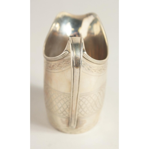 1881 - A GEORGE III SILVER CREAM JUG with reeded edge and engraved body. London 1795.